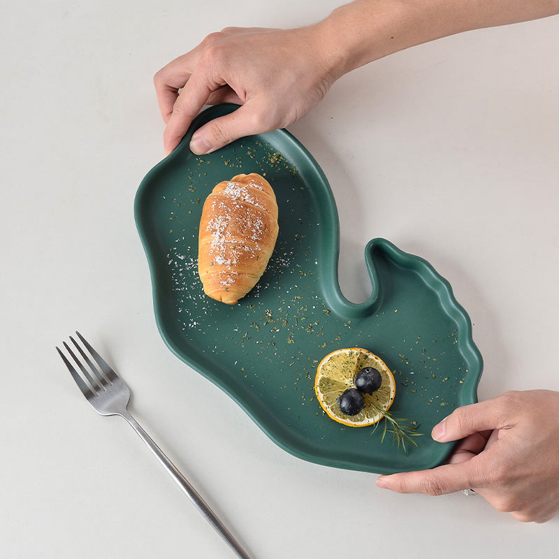 A ceramic dessert plate with bread