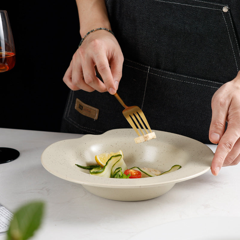 A ceramic bowl with salad